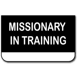 small pocket style imitation LDS missionary tag, black background with the words Missionary In Training engraved in white